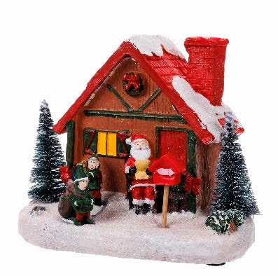 Vila de Natal iluminada com casinhas e pista de patinação